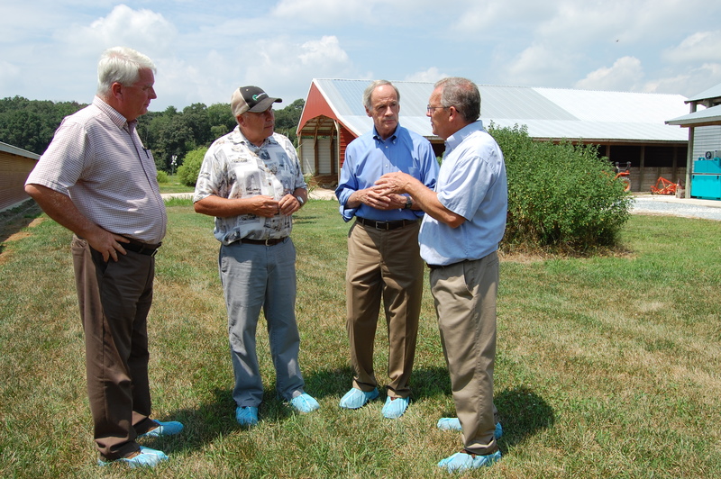 Industry and state leaders (l-r) Delaware Department of Agriculture Secretary Ed Kee, retired University of Delaware poultry specialist Bud Malone, U.S. Sen. Tom Carper and State Rep. Rich Collins, R-Millsboro, discuss freezing as a viable way to handle and recycle dead chickens on local poultry farms. SOURCE SUBMITTED